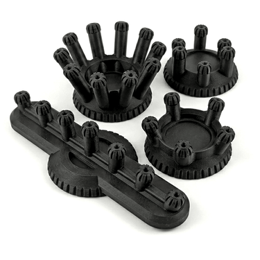 Set of black plastic components on a white background